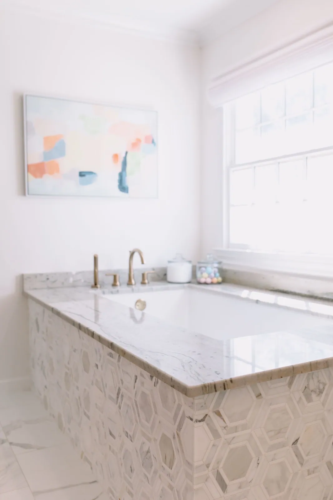 Marble bath with brass fixtures