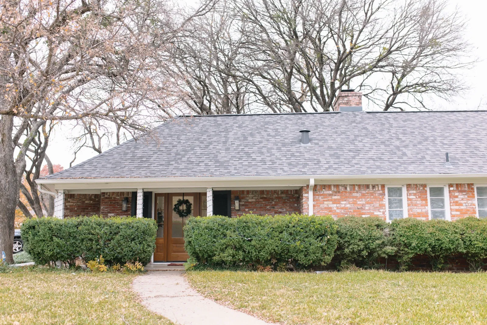 Brick ranch home with a wide front lawn