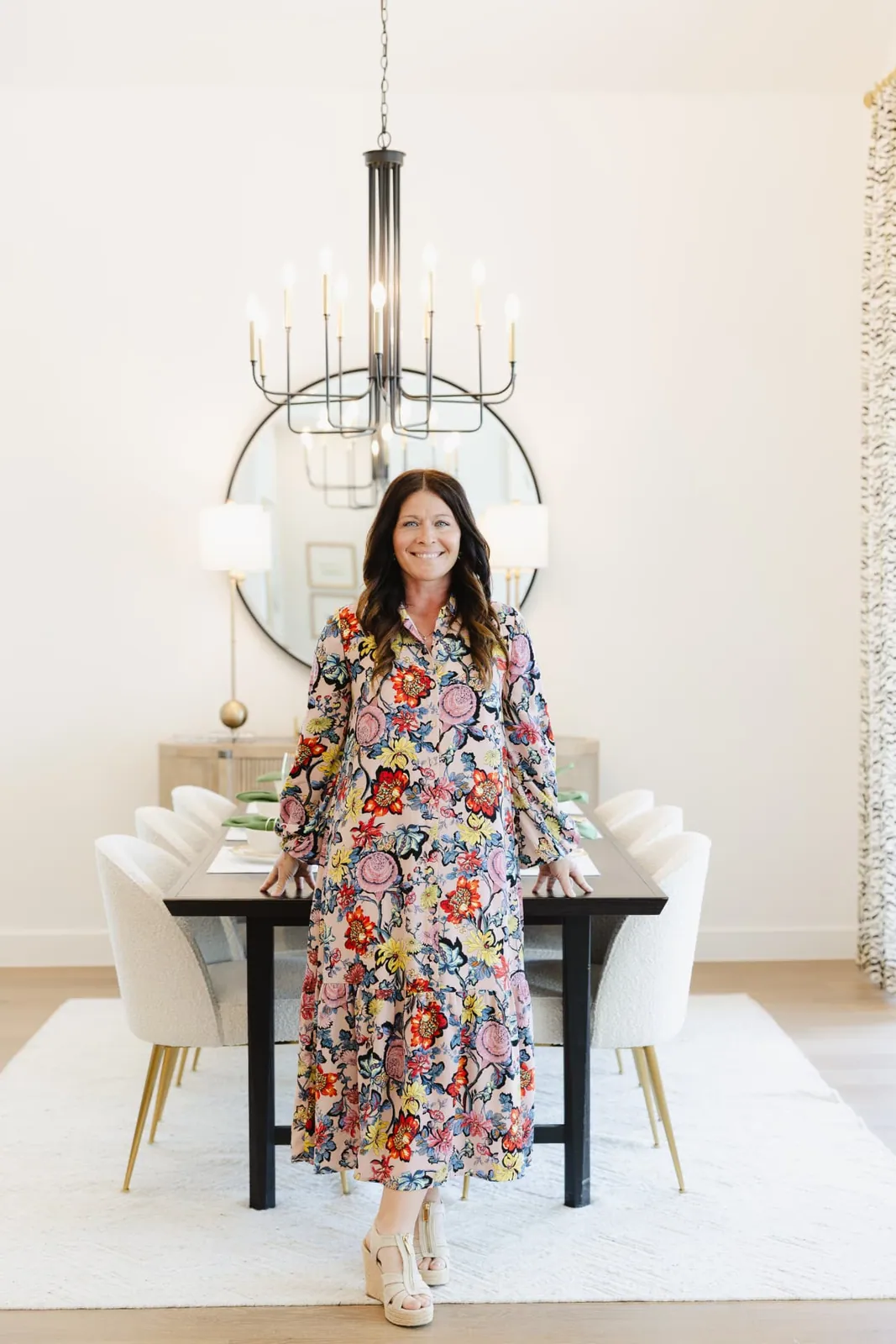 Jenny Marsh standing in a bright dining room