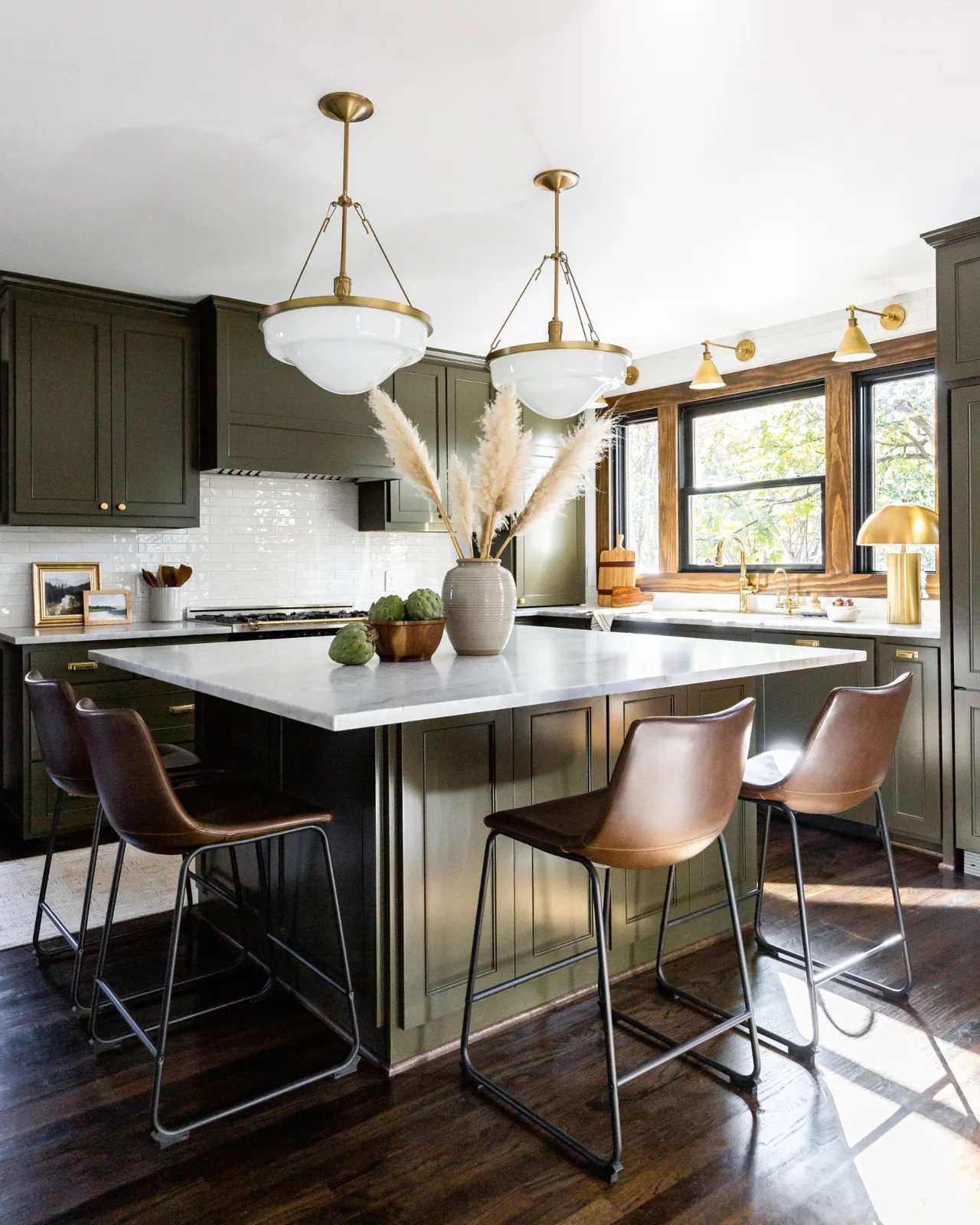 Olive green kitchen with marble counters