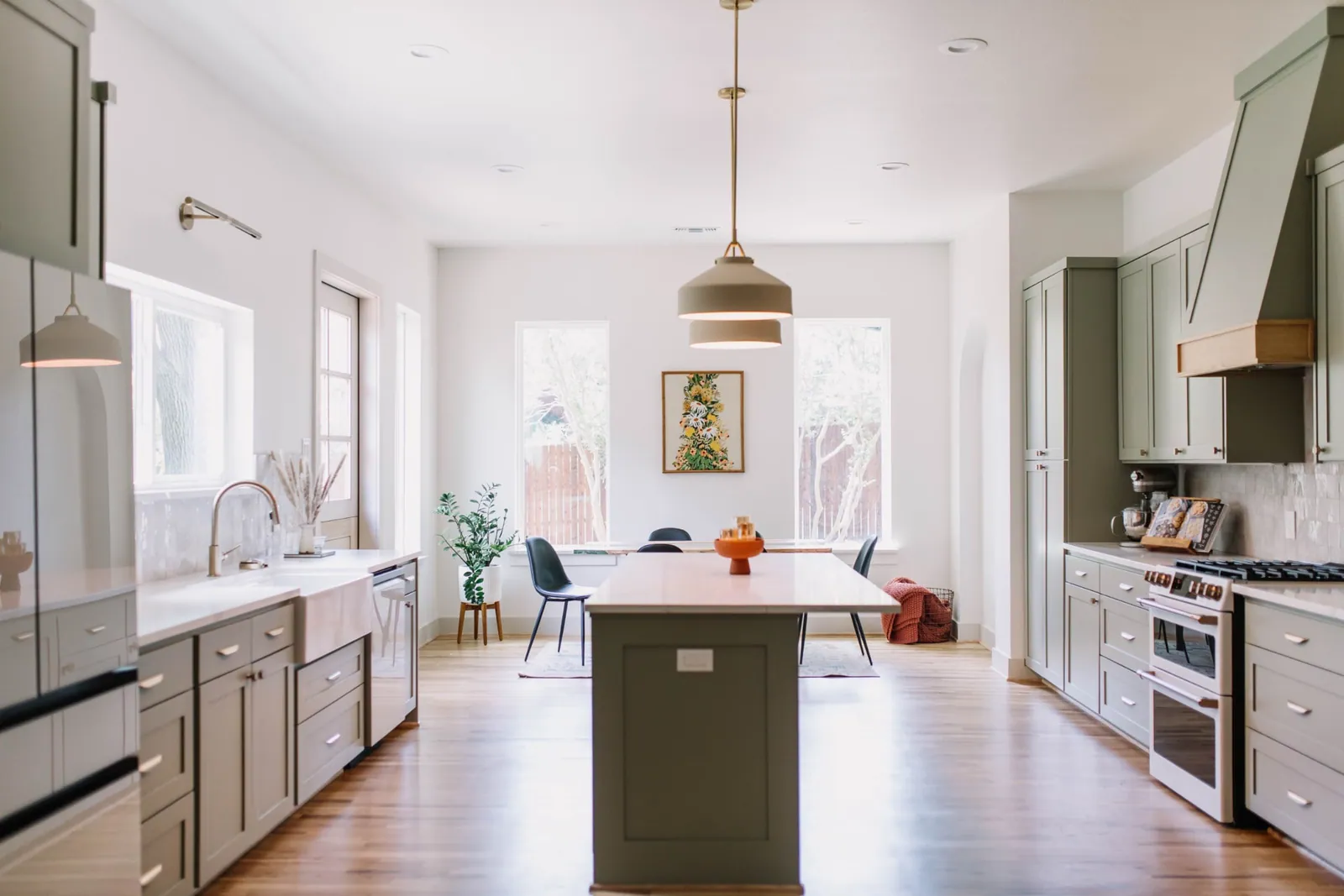 Sage kitchen with arched doorways
